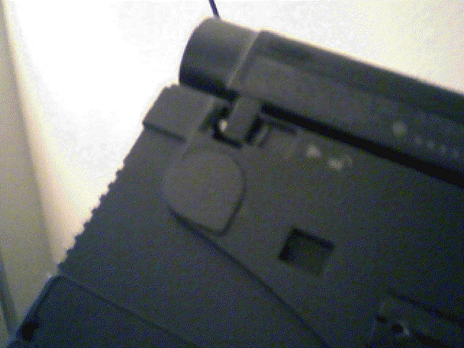 Picture of CMOS battery compartment on bottom of laptop