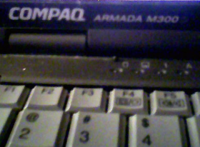 Picture of a laptop showing its model of &ldquo;COMPAQ ARMADA M300&rdquo;