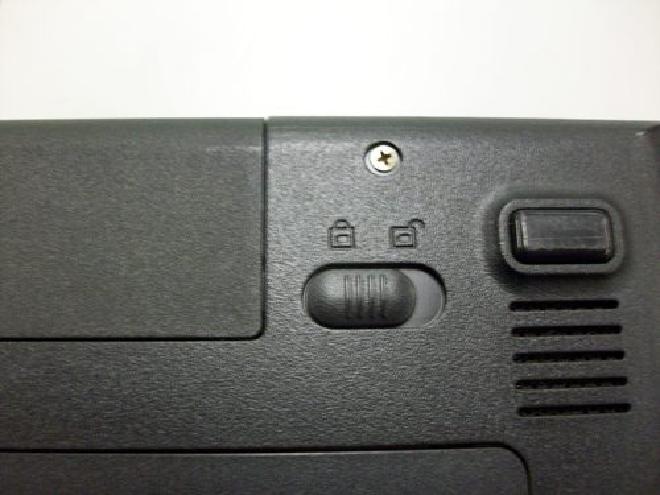 Picture of battery lock switch on bottom of laptop