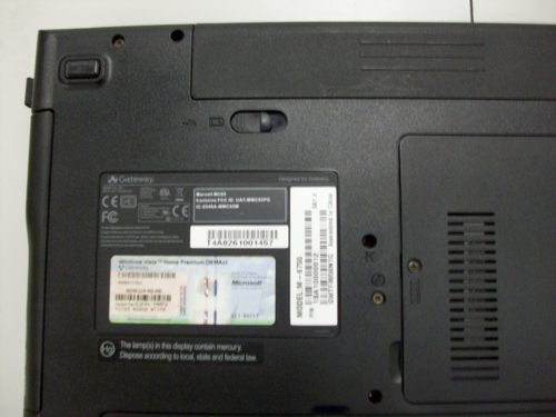 Picture of keyboard screw hole on bottom of laptop (marked by a “K”)