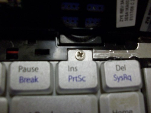 Picture of screw above INS key