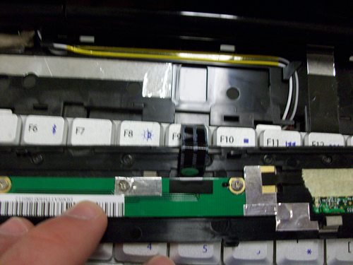 Picture of ribbon cable on bottom of plastic bar