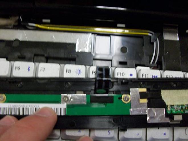 Picture of ribbon cable on bottom of plastic bar