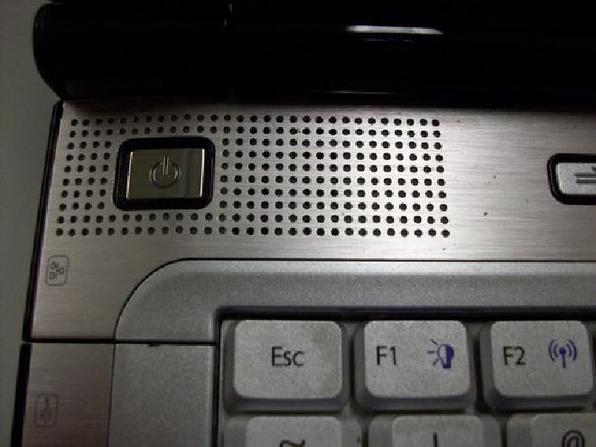 Picture of plastic bar containing laptop power and multimedia buttons