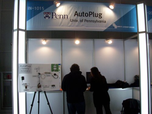 Picture of Madhur and Kai setting up our booth