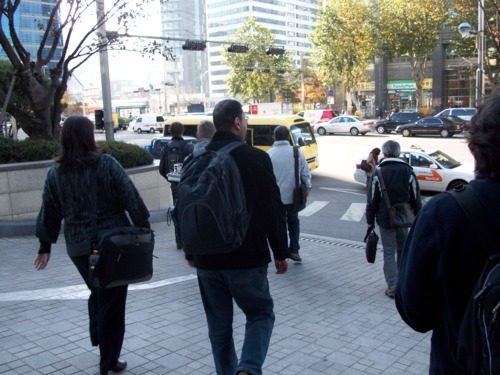 Picture of competitors walking to shuttle bus