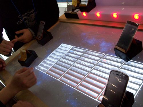 Picture of comparing several phones on the table-top touchscreen
